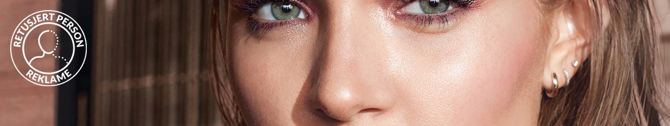 Maybelline Blush and Bronzer products illustrative banner image - Close up of green eyed model 
